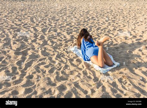 teen beach ass|Rear view beautiful young girl beach sand off ass slow motion。